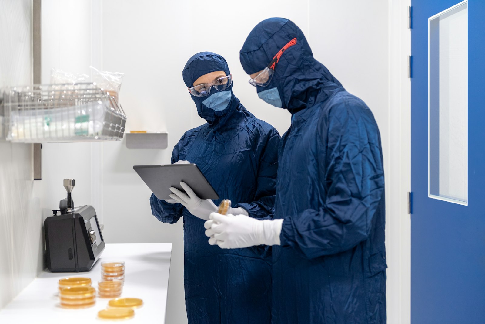 Quality control specialists in a cleanroom laboratory